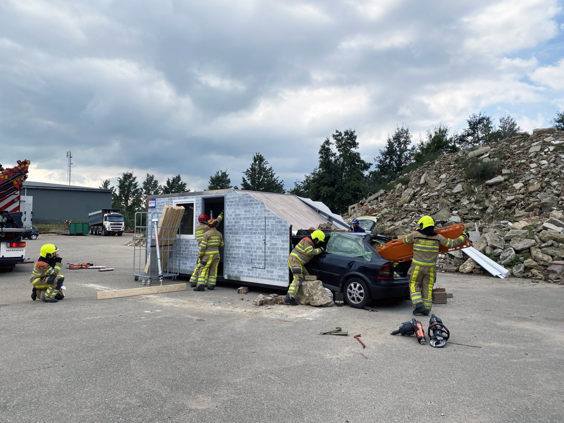 The Collapsed House Mounted on a Hook Arm Container Frame